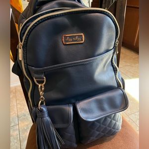 Itzy Ritzy Navy Gingham Boss Diaper Backpack.